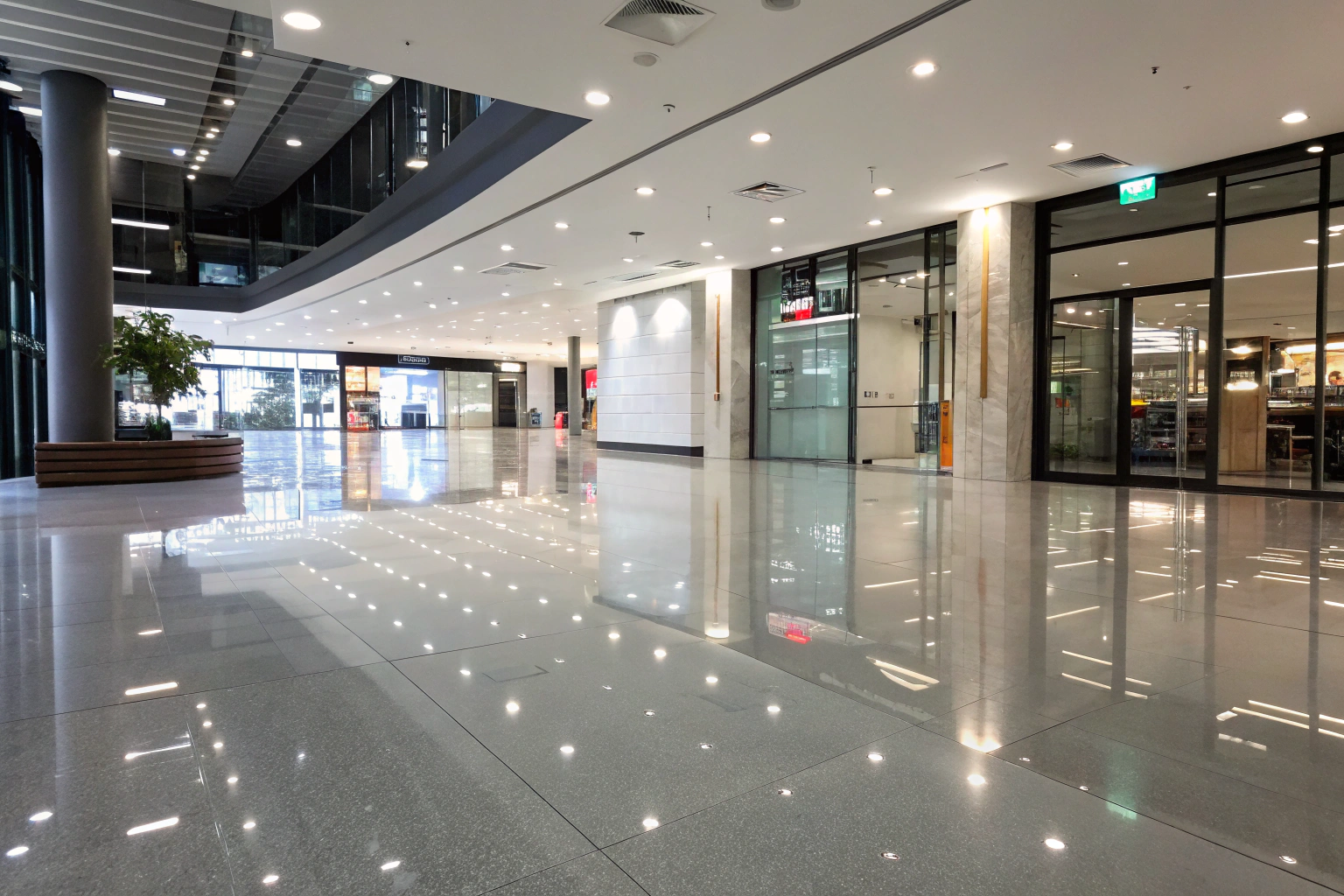 Glossy polished commercial floor in a modern retail and office lobby space